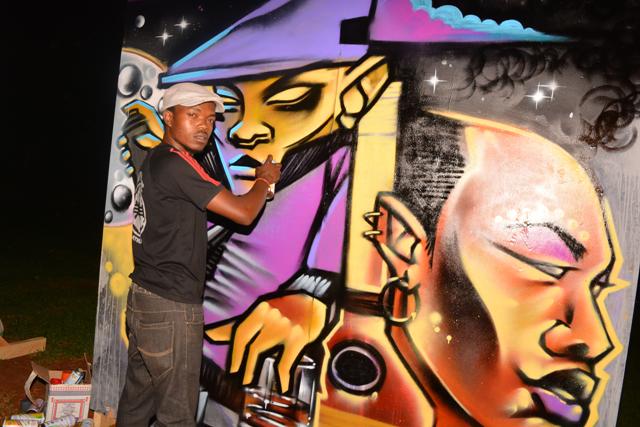 Graffiti artist Swift and his piece.