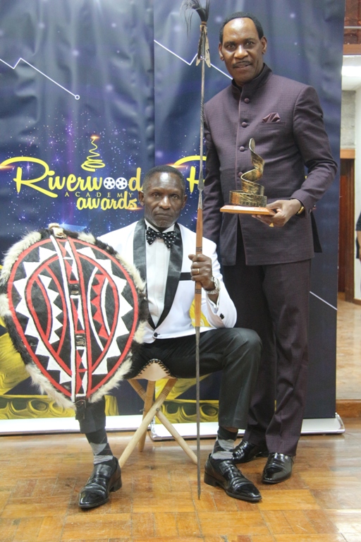 Lifetime Archievement Award winner Raymond Ofula and Kenya Film Classification Board CEO Ezekiel Mutua.