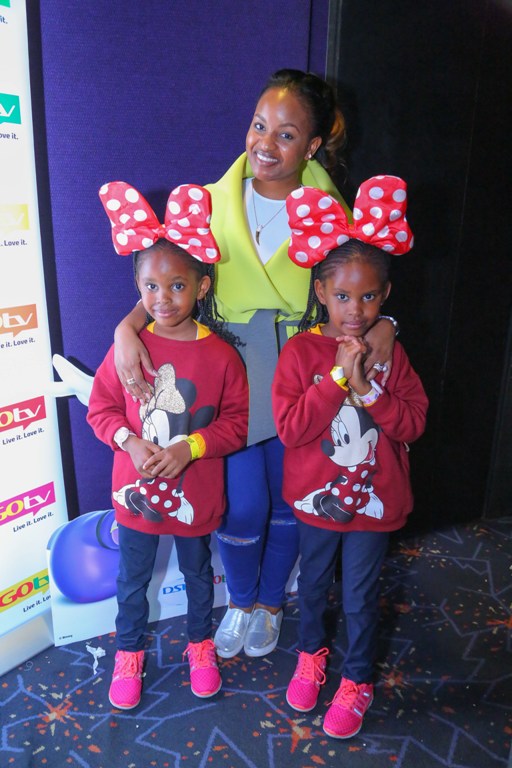 Radio Africa's, Grace Msalame with her twin daughters, Zawadi and Raha.